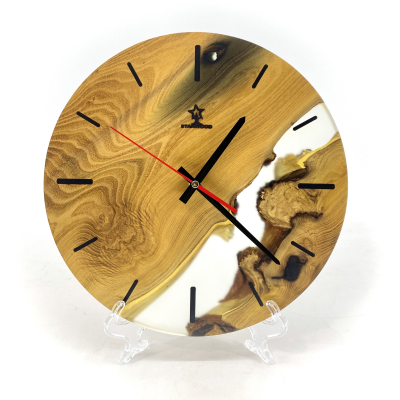 Wall clock made of natural Acacia wood and epoxy resin 