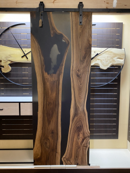 Interior doors made of solid walnut and epoxy resin on a hanging mechanism with a closer