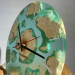Wall clock "Cavallo" made of natural wood burl Maple with epoxy resin