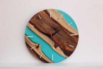Wall clock made of natural walnut wood and epoxy resin 