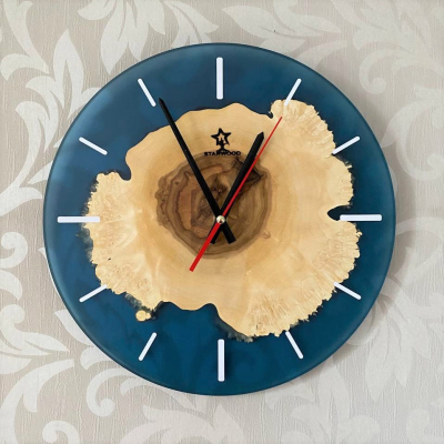 Wall clock made of natural maple wood and epoxy resin 
